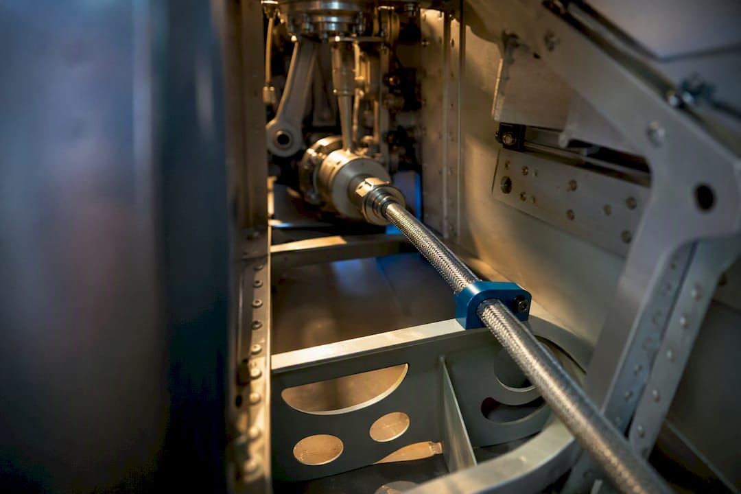 Flexible shaft routed inside aircraft actuation structure