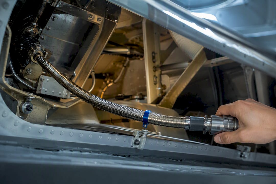 Flexible shaft routed through aircraft structure