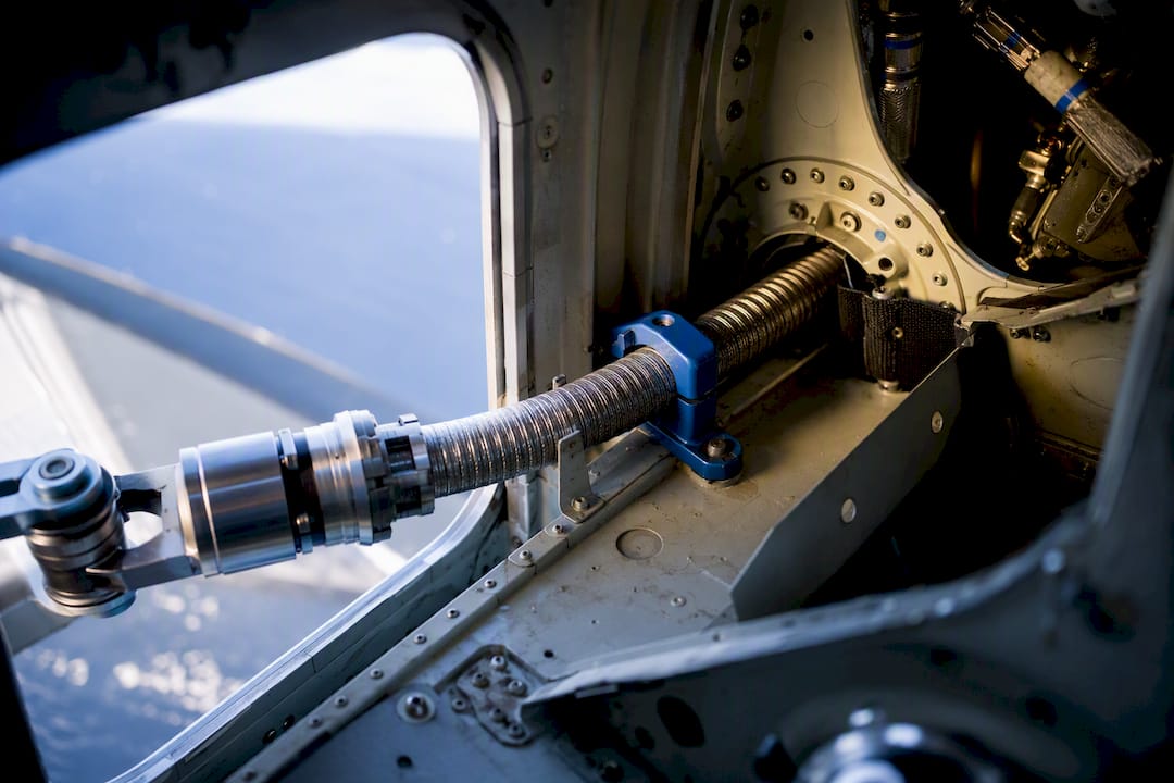 Flexible shaft routed through aircraft structure